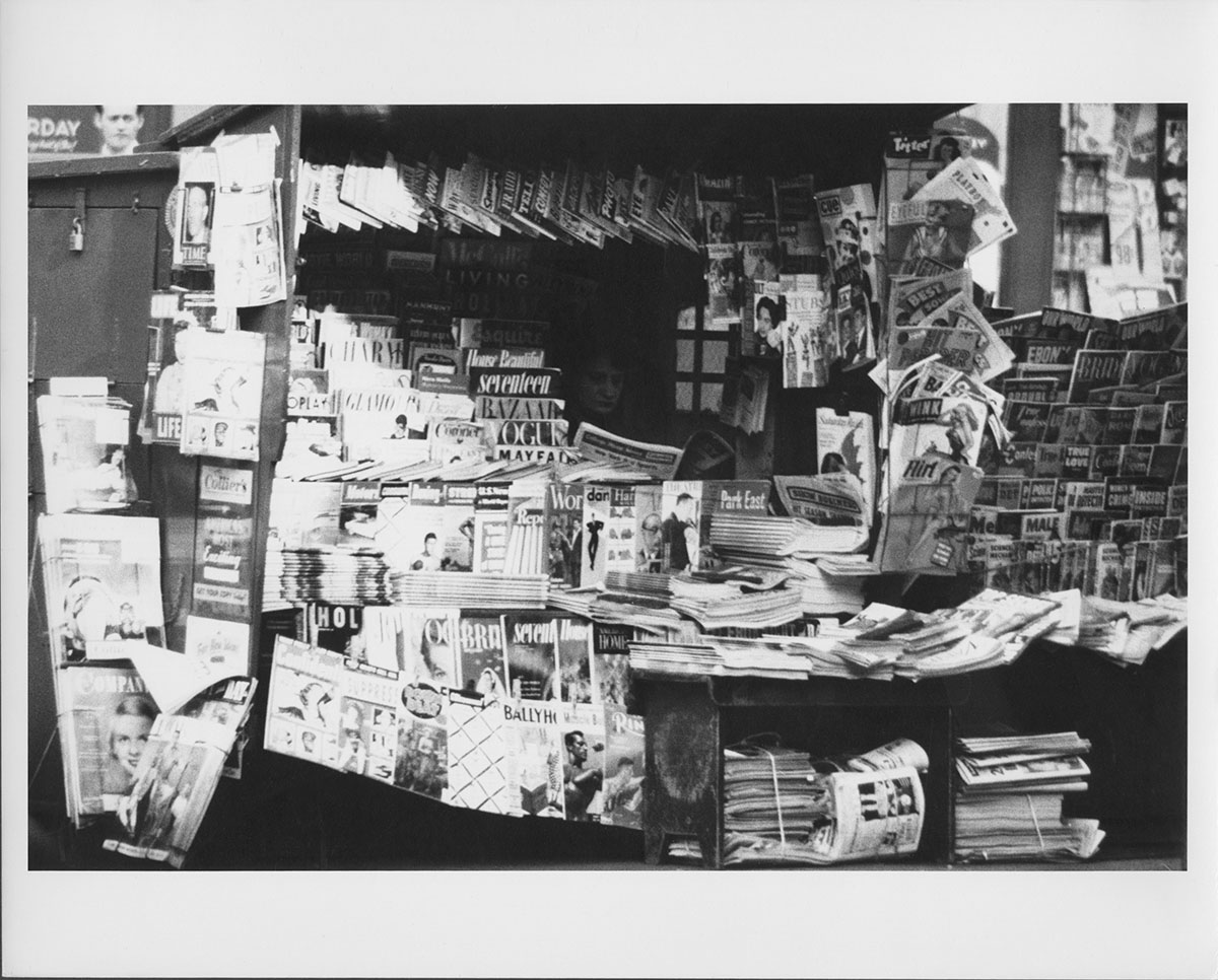 Woman reading inside newsstand, 1953, Anthony Angel