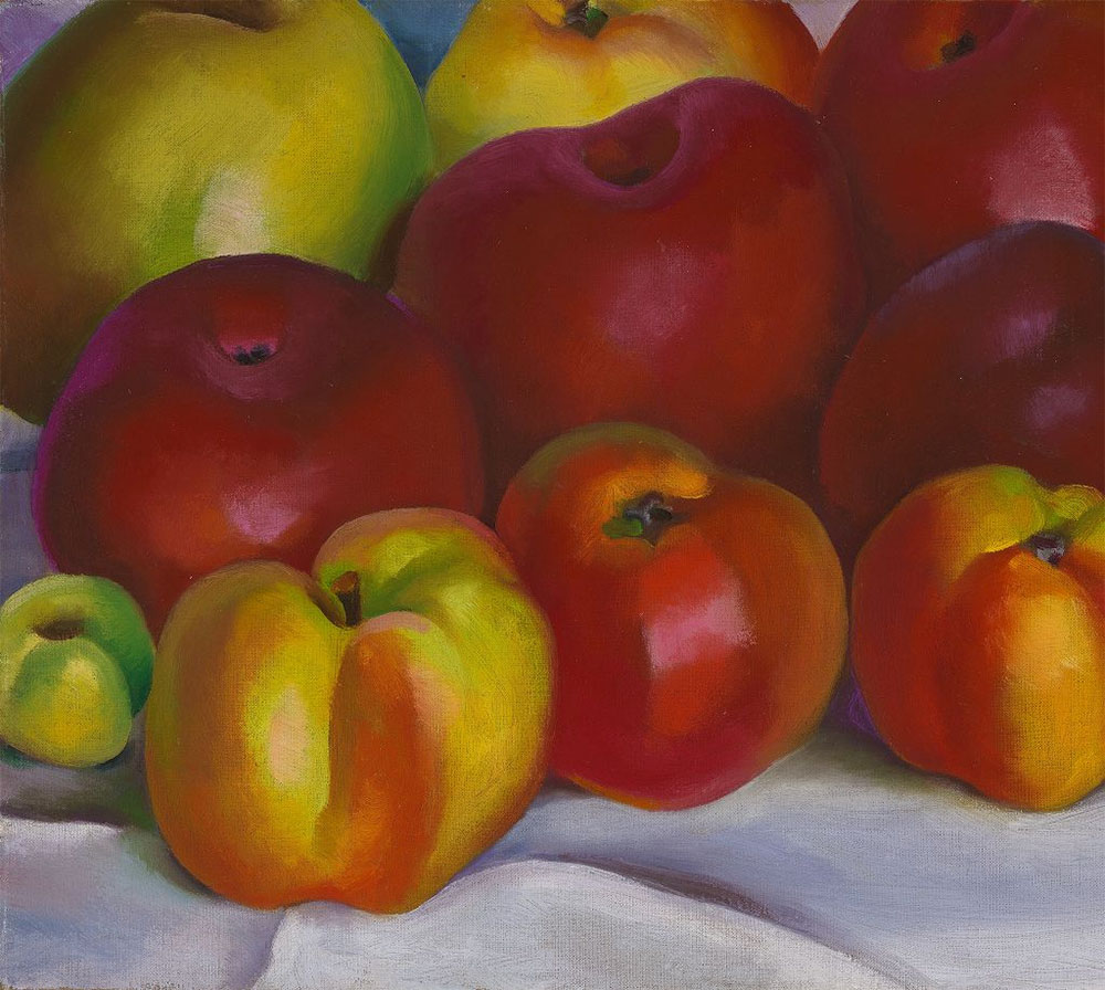 A whole bunch of lusciously red apples.