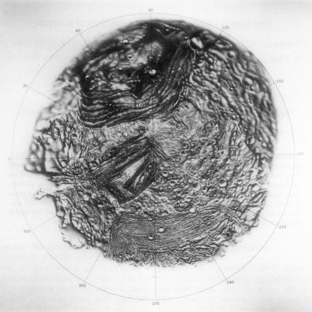 A ghostly half-map of a dark, rocky moon. The reasons for the map's strange, incomplete nature are explained in the linked Instagram post.